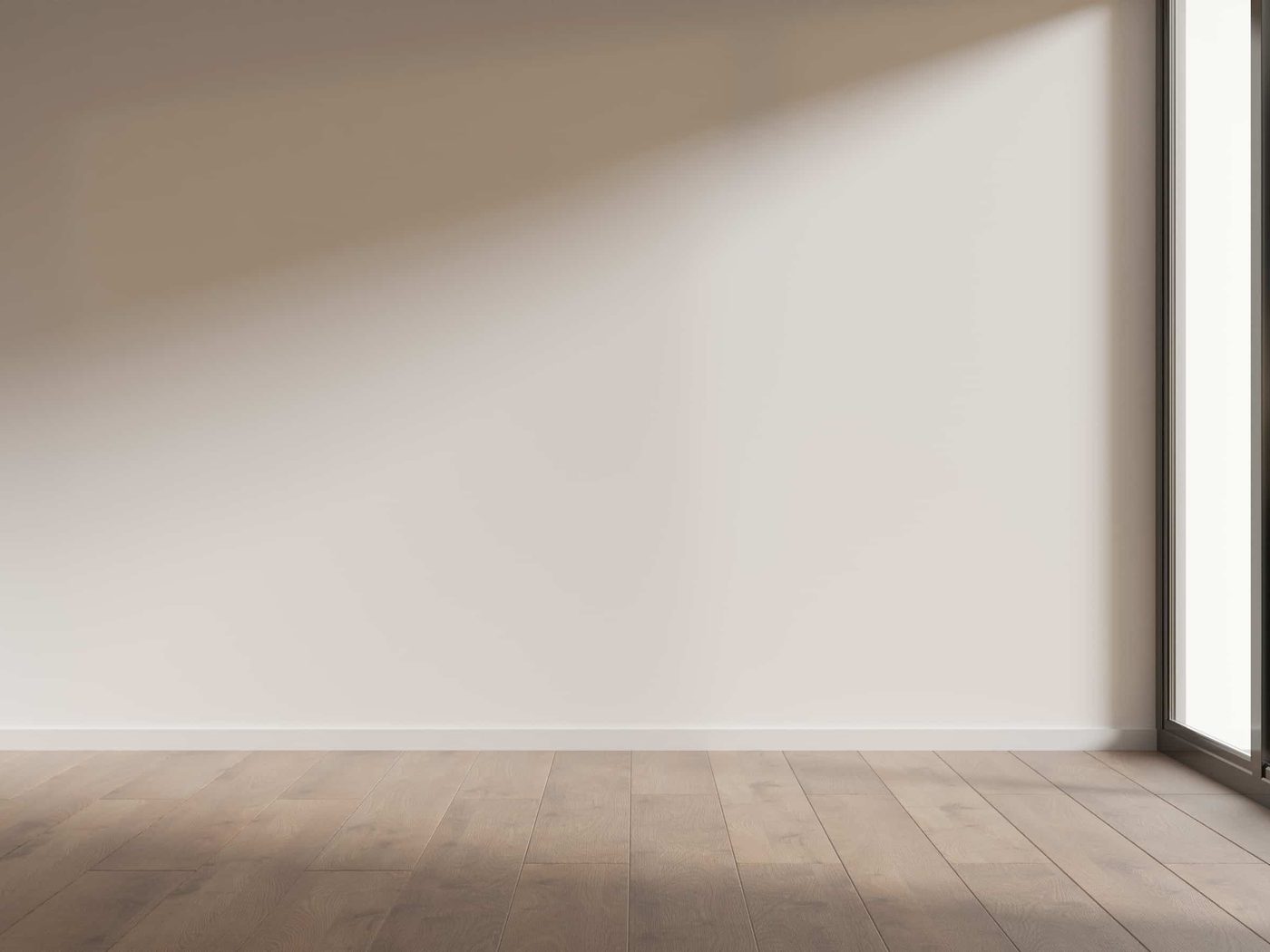 A bare bedroom with a ceiling fan before the scheme