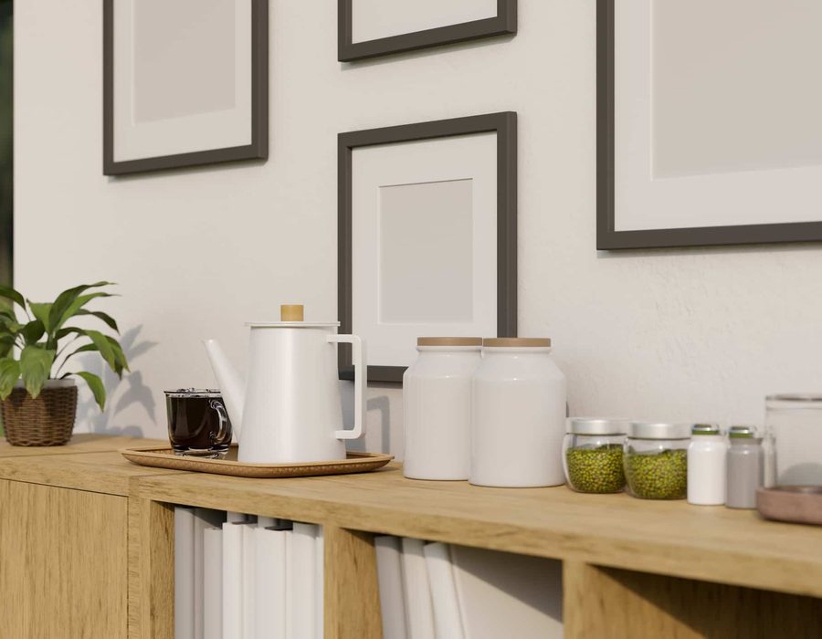 A kitchen shelf with a kettle and jars