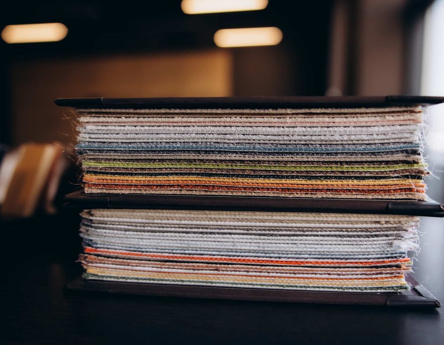 A stack of fabric and carpet samples
