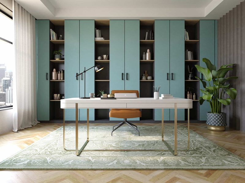 A study with a wall of teal shelving
