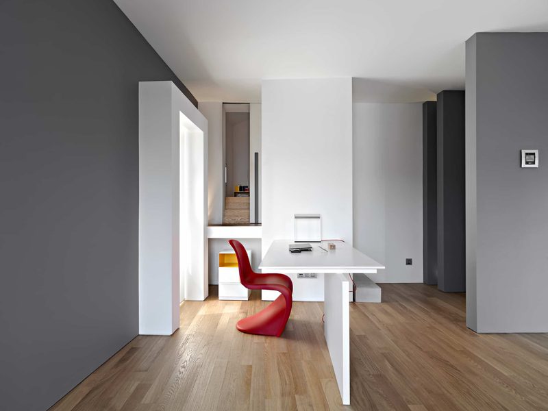A plain hard-working room with a desk