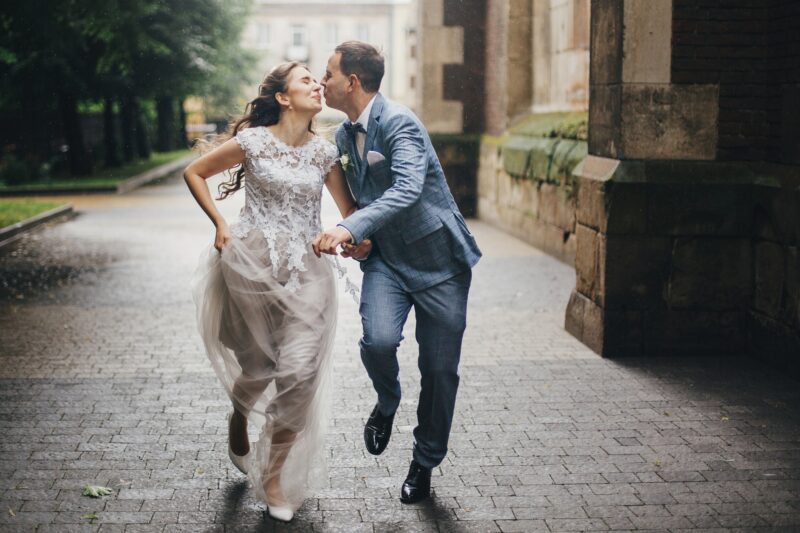 Couple kissing in the rain