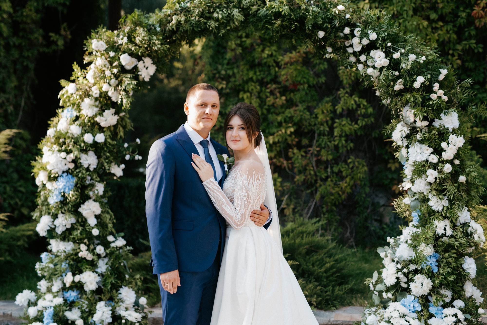 Newlyweds celebrating at a garden ceremony